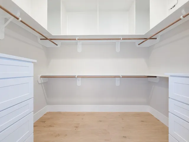 a view of an empty walk in closet