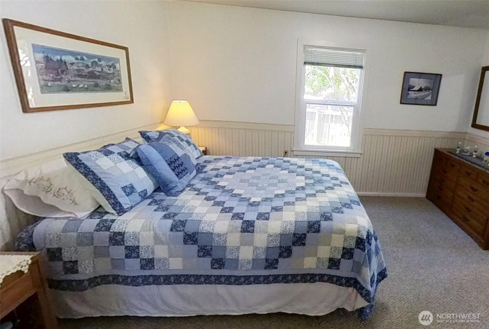 1671 Oak Bay Road Port Hadlock, WA 98339 - Photo 17 of 33 a bed sitting in a bedroom next to a window