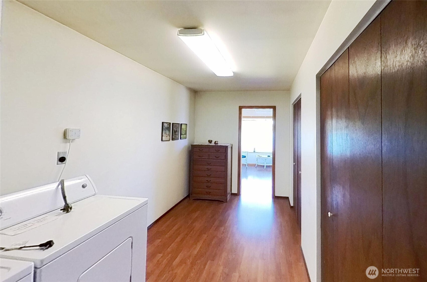 1671 Oak Bay Road Port Hadlock, WA 98339 - Photo 24 of 33 a hallway with wooden floor windows and a bathroom