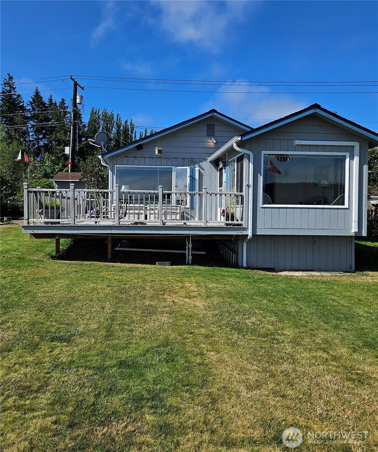 1671 Oak Bay Road Port Hadlock, WA 98339 - Photo 29 of 33 a front view of a house with a yard