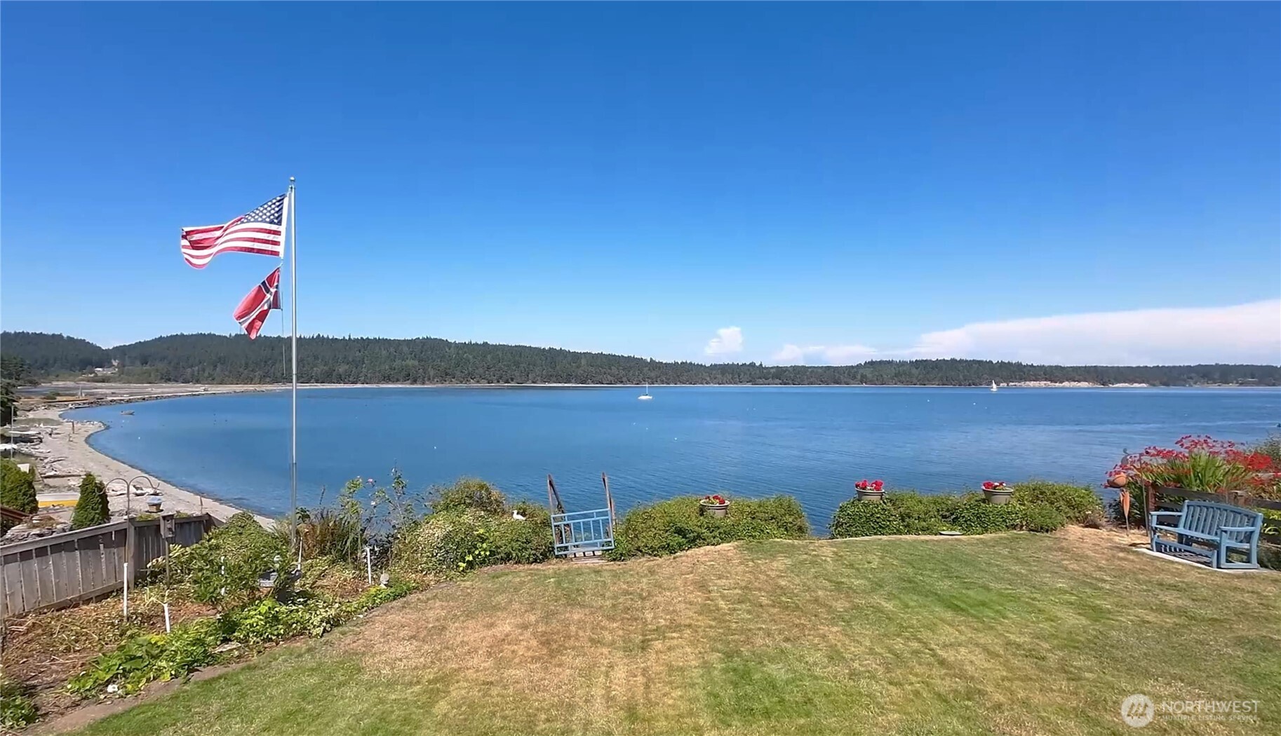 1671 Oak Bay Road Port Hadlock, WA 98339 - Photo 5 of 33 a view of a lake from a yard