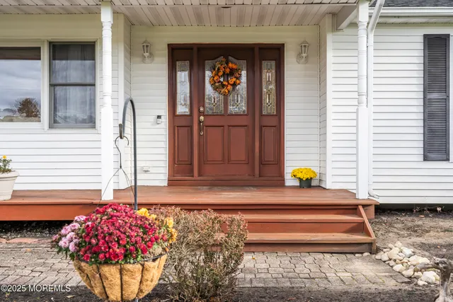 a living room with furniture and a rug
