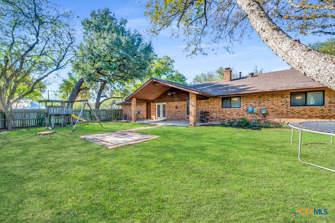 111 Oldtowne Road Seguin, TX 78155 - Photo 30 of 31 a view of house with a big yard and large trees