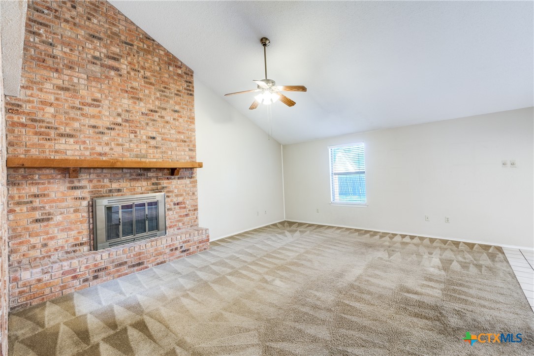 111 Oldtowne Road Seguin, TX 78155 - Photo 5 of 31 an empty room with windows and fireplace