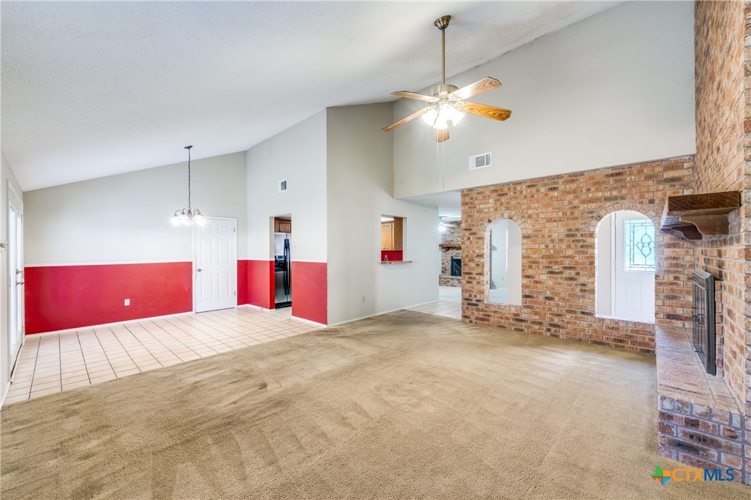 111 Oldtowne Road Seguin, TX 78155 - Photo 8 of 31 a view of empty room with fireplace and fan