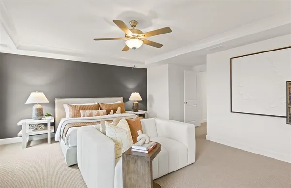 a bed room with a bed and a ceiling fan