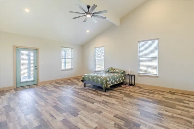 a bedroom with a bed and window