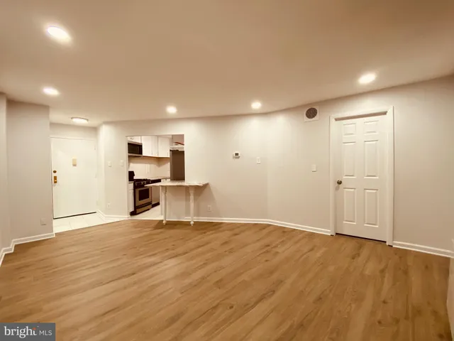 a view of kitchen with wooden floor