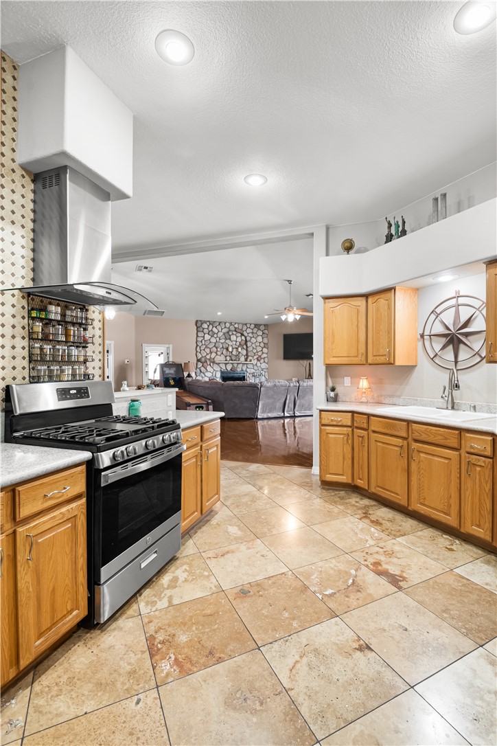 2898 Mountain Trail Road Kingman, AZ 86401 - Photo 75 of 75 a large kitchen with stainless steel appliances and a sink