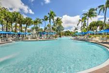 8385 Whisper Trace Way, Unit 104 Naples, FL 34114 - Photo 2 of 18 a view of a lake with a park