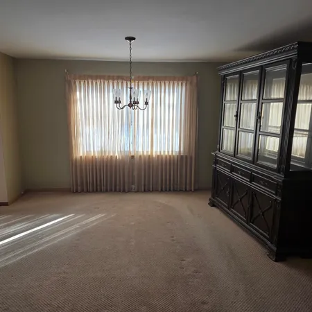a view of an empty room with windows