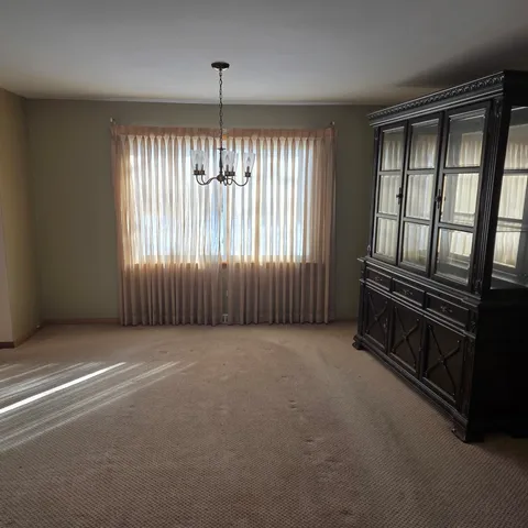 a view of an empty room with windows