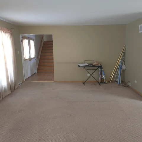 a view of an empty room with windows