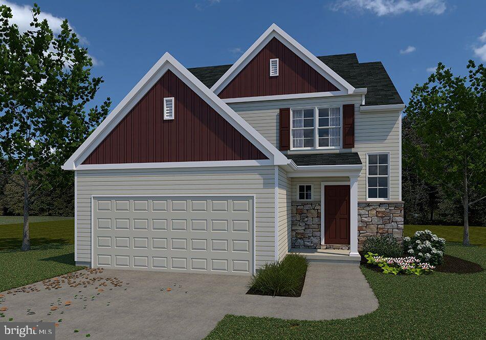 335 Windmill Way, Unit 70 Lititz, PA 17543 - Photo 1 of 1 a front view of a house with a yard and garage
