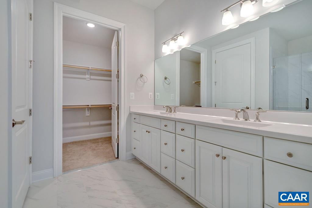 379 Claibourne Road Crozet, VA 22932 - Photo 27 of 38 a bathroom with double vanity sink and a mirror