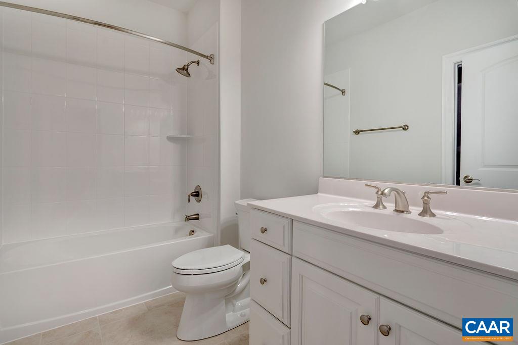 379 Claibourne Road Crozet, VA 22932 - Photo 30 of 38 a bathroom with a toilet a sink and a bathtub
