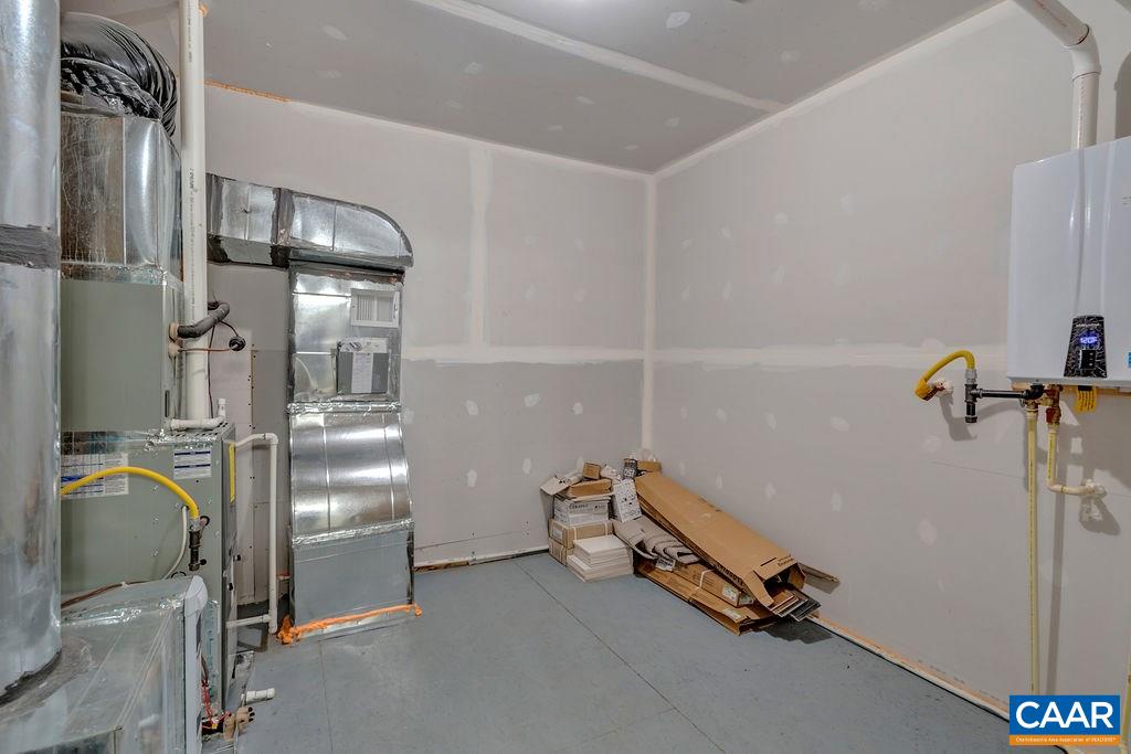 379 Claibourne Road Crozet, VA 22932 - Photo 36 of 38 a room with water heater refrigerator washer and dryer