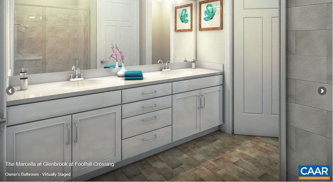 379 Claibourne Road Crozet, VA 22932 - Photo 6 of 38 a bathroom with a double vanity sink and a mirror