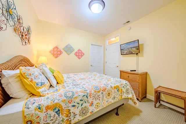 a bedroom with a bed and lamp