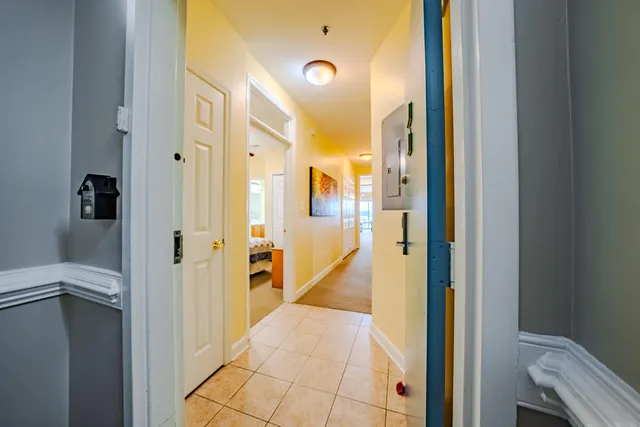a bathroom with a glass shower door and a sink
