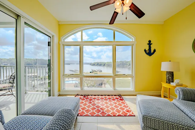 a living room with a couch and a large window