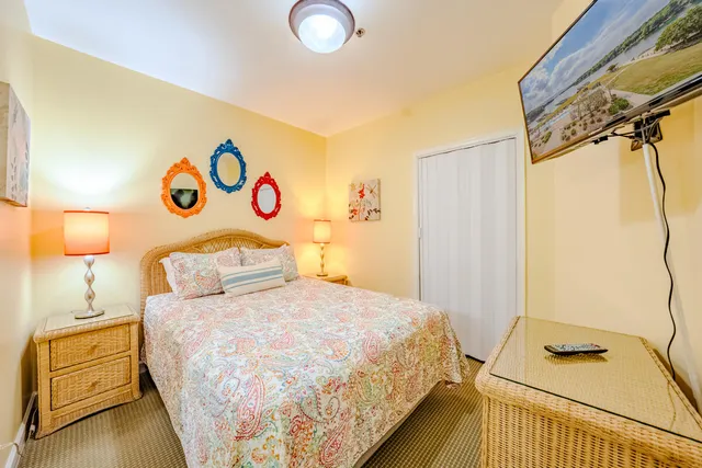 a bedroom with a bed and lamps