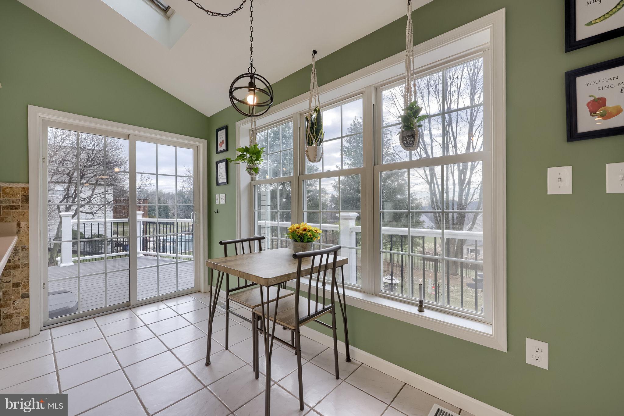 22 Royal Drive Lititz, PA 17543 - Photo 15 of 47 a view of a dining room with furniture large windows and wooden floor