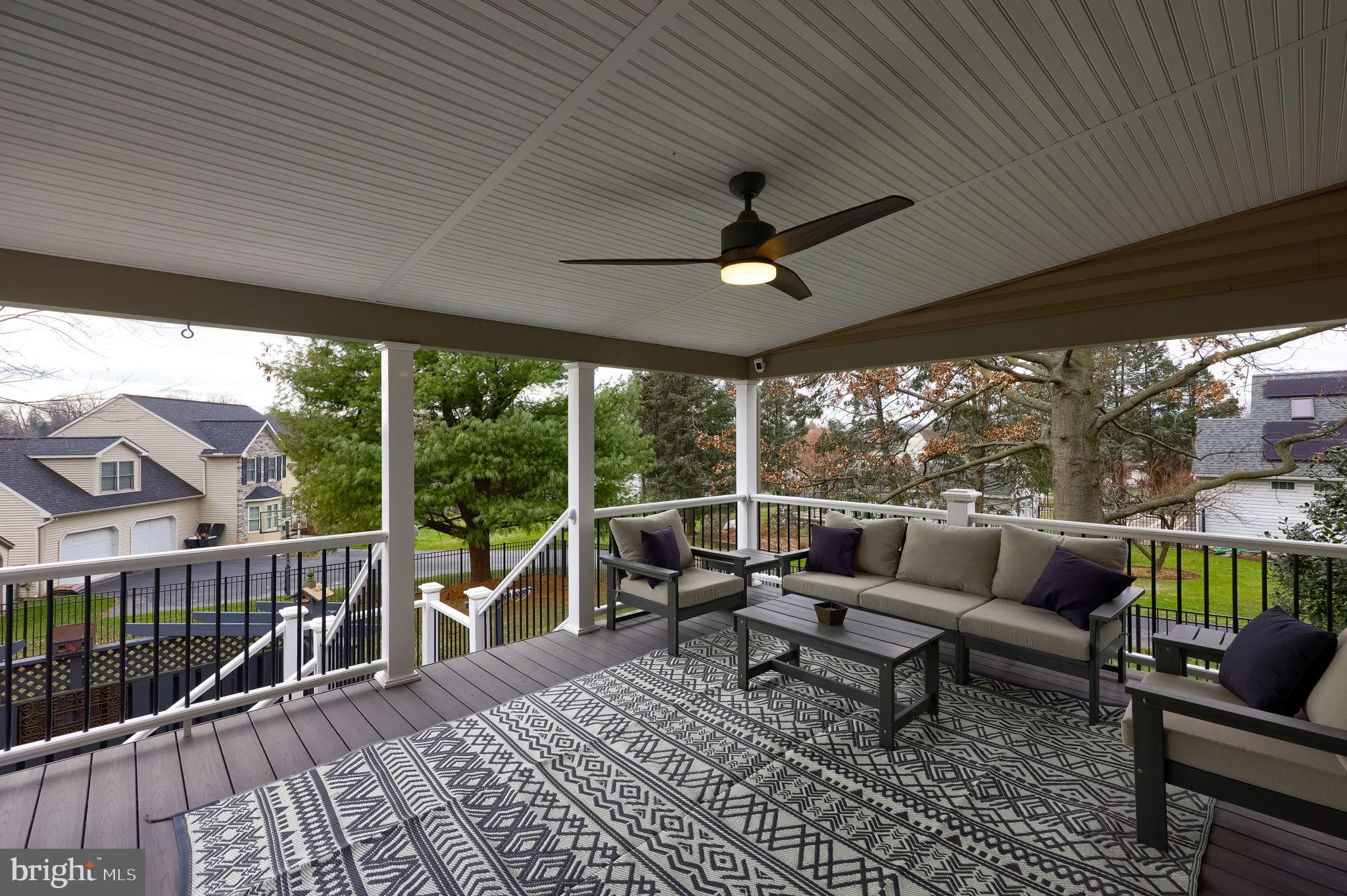 22 Royal Drive Lititz, PA 17543 - Photo 18 of 47 a living room with patio furniture and a floor to ceiling window