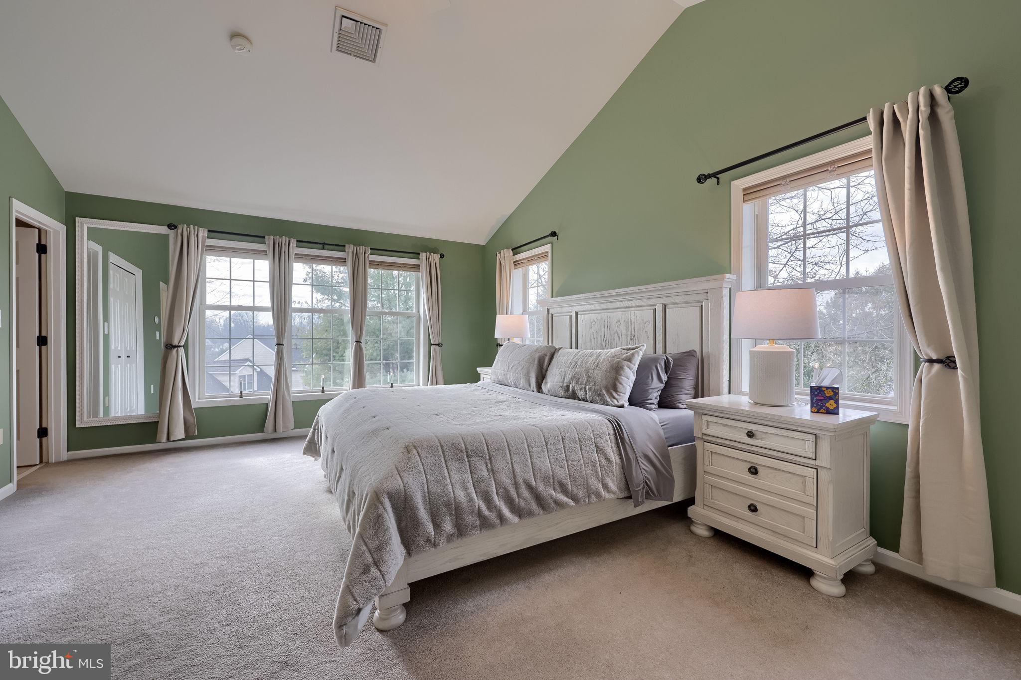 22 Royal Drive Lititz, PA 17543 - Photo 24 of 47 a spacious bedroom with a bed and a large window