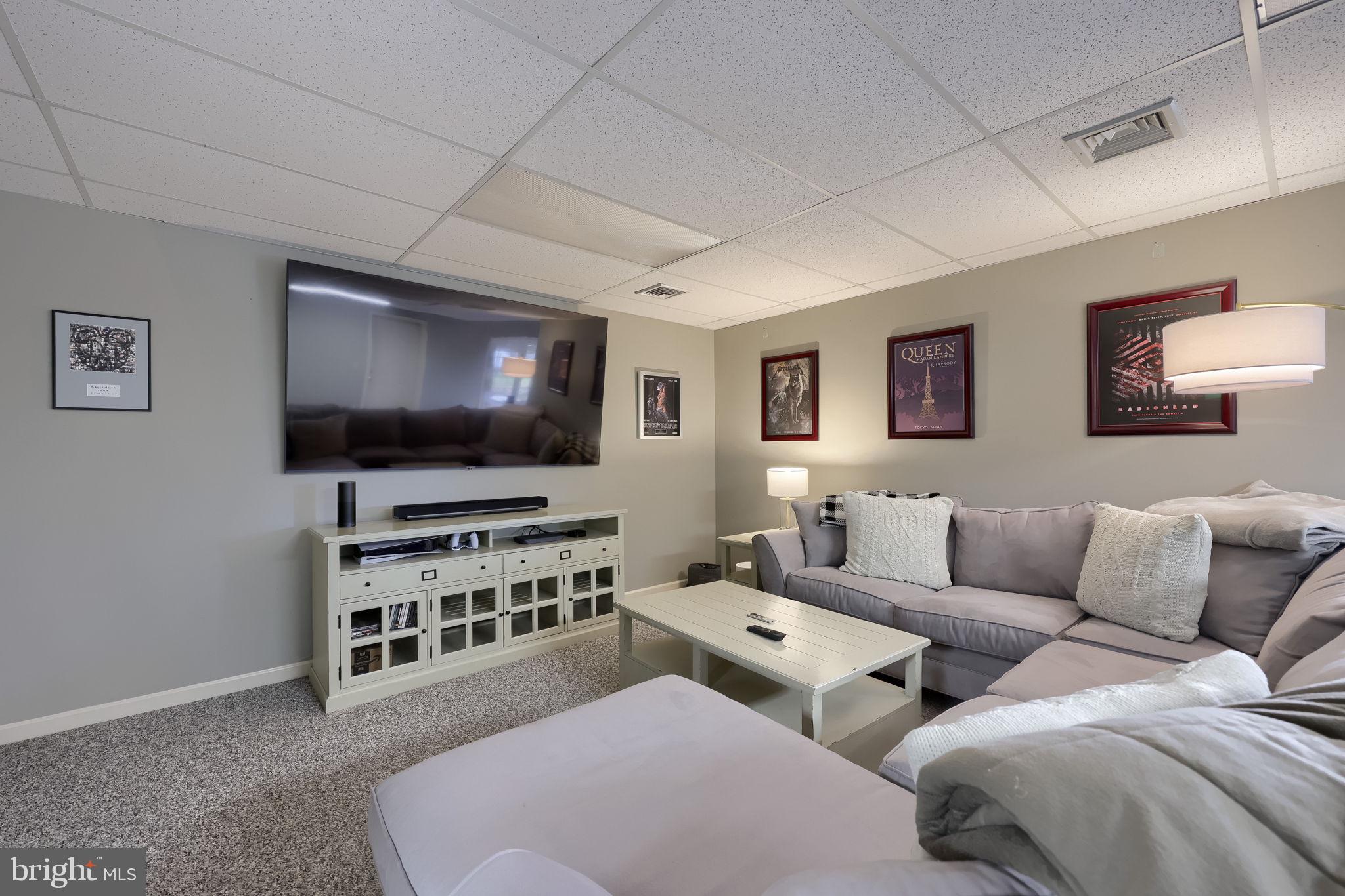 22 Royal Drive Lititz, PA 17543 - Photo 38 of 47 a living room with couches and a flat screen tv