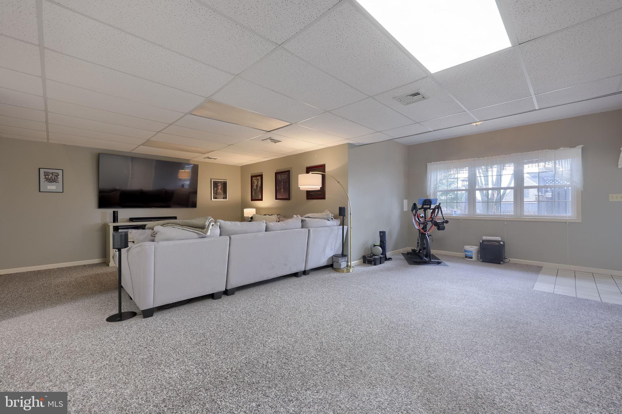 22 Royal Drive Lititz, PA 17543 - Photo 39 of 47 a living room with furniture and a flat screen tv