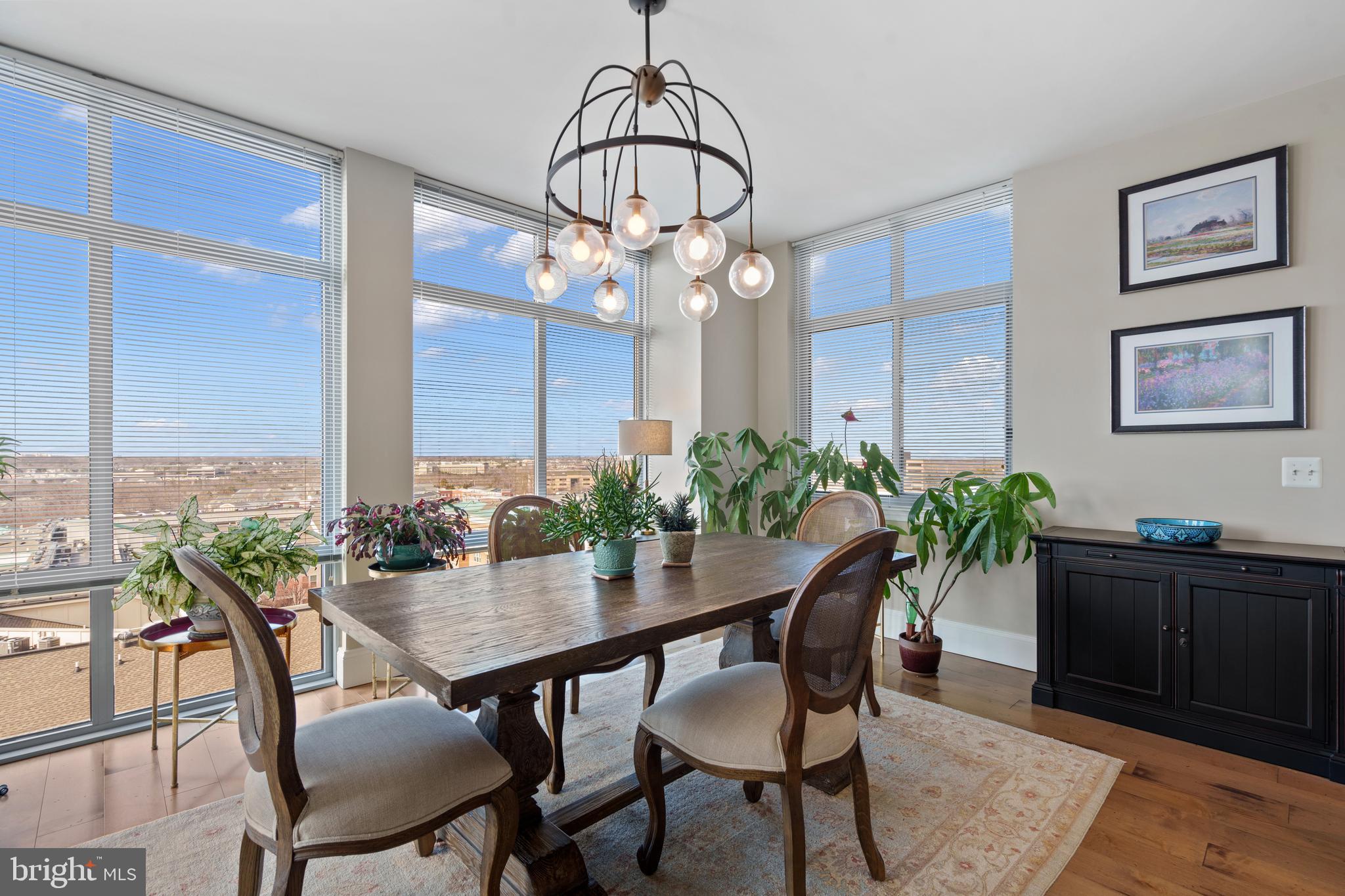 11990 Market Street, Unit 813 Reston, VA 20190 - Photo 11 of 48 a view of a dining room with furniture window and wooden floor