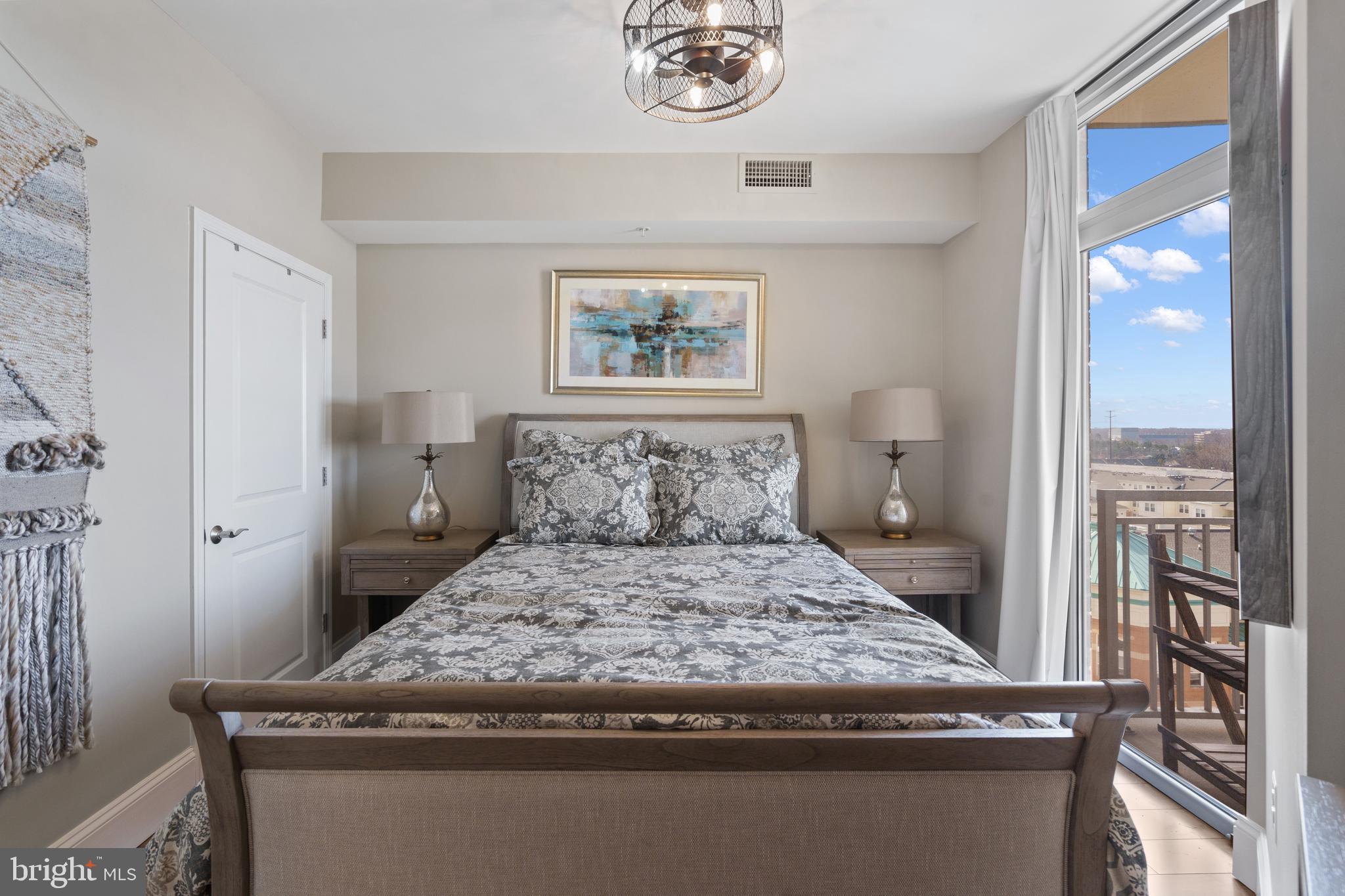 11990 Market Street, Unit 813 Reston, VA 20190 - Photo 13 of 48 a bedroom with a bed and a window