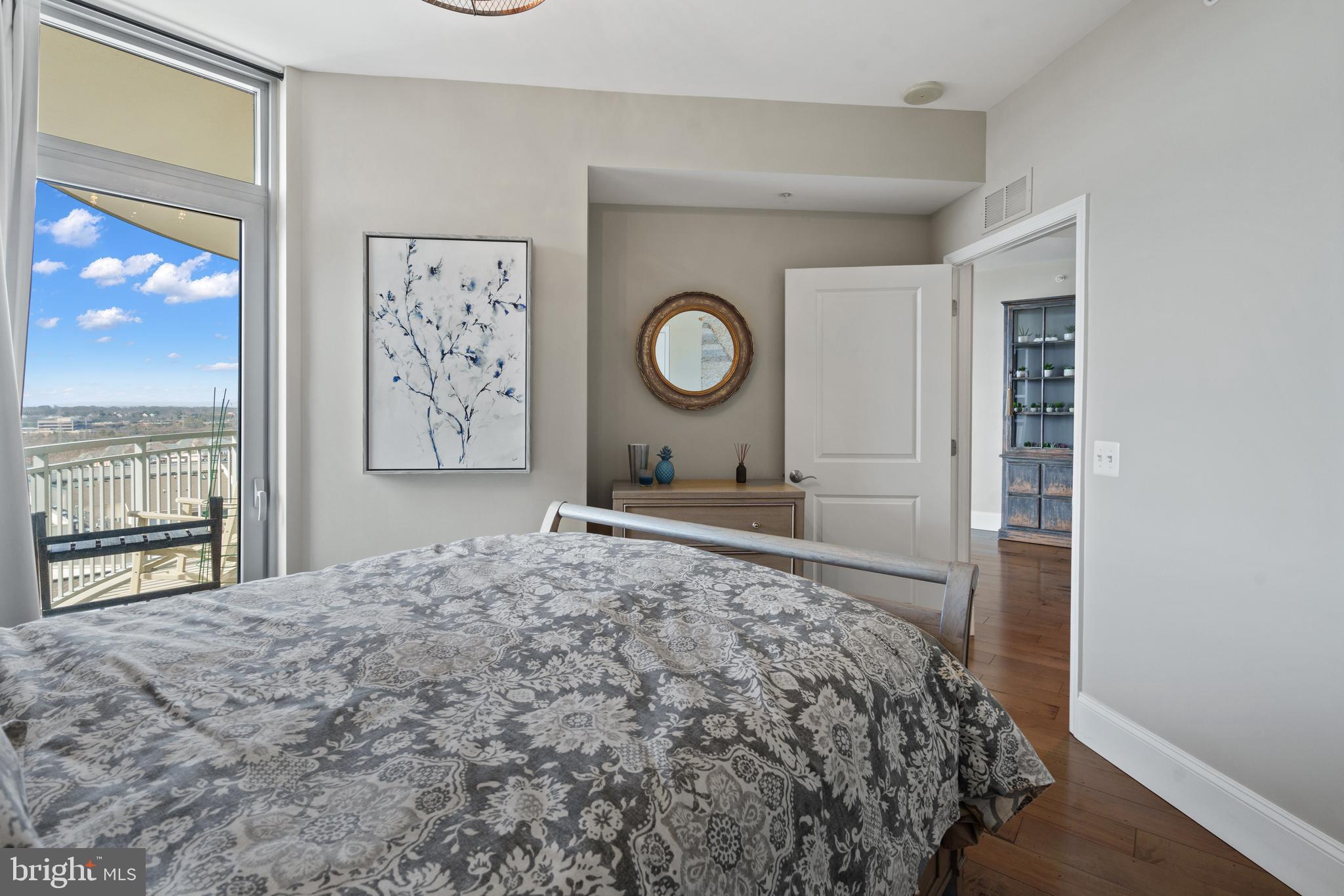 11990 Market Street, Unit 813 Reston, VA 20190 - Photo 15 of 48 a bedroom with a bed and a window