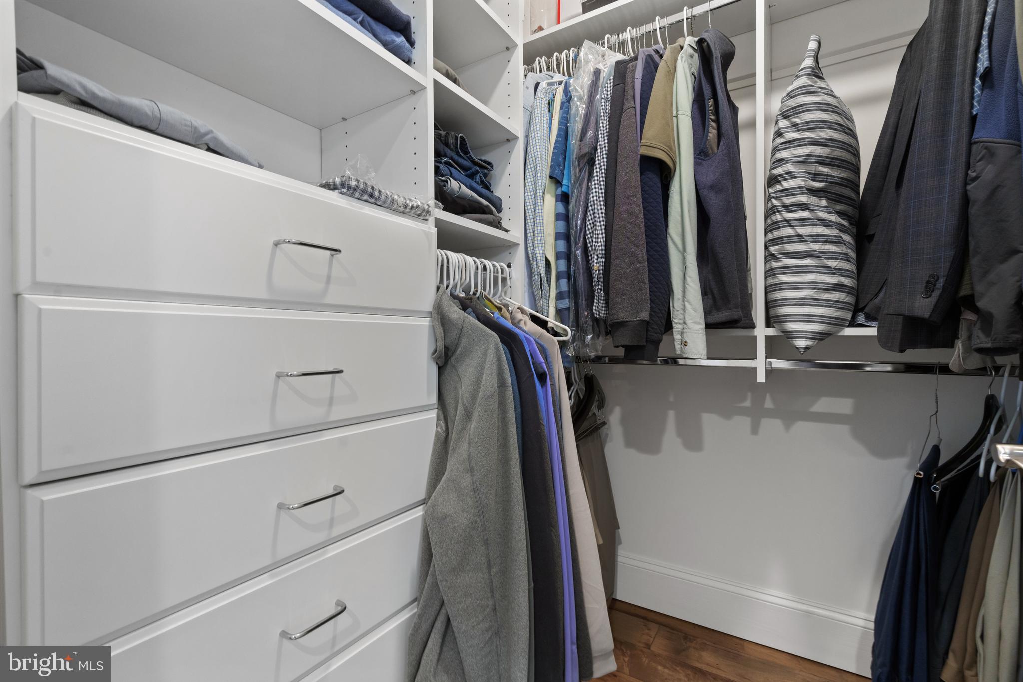 11990 Market Street, Unit 813 Reston, VA 20190 - Photo 21 of 48 a view of walk in closet with clothes and shoes