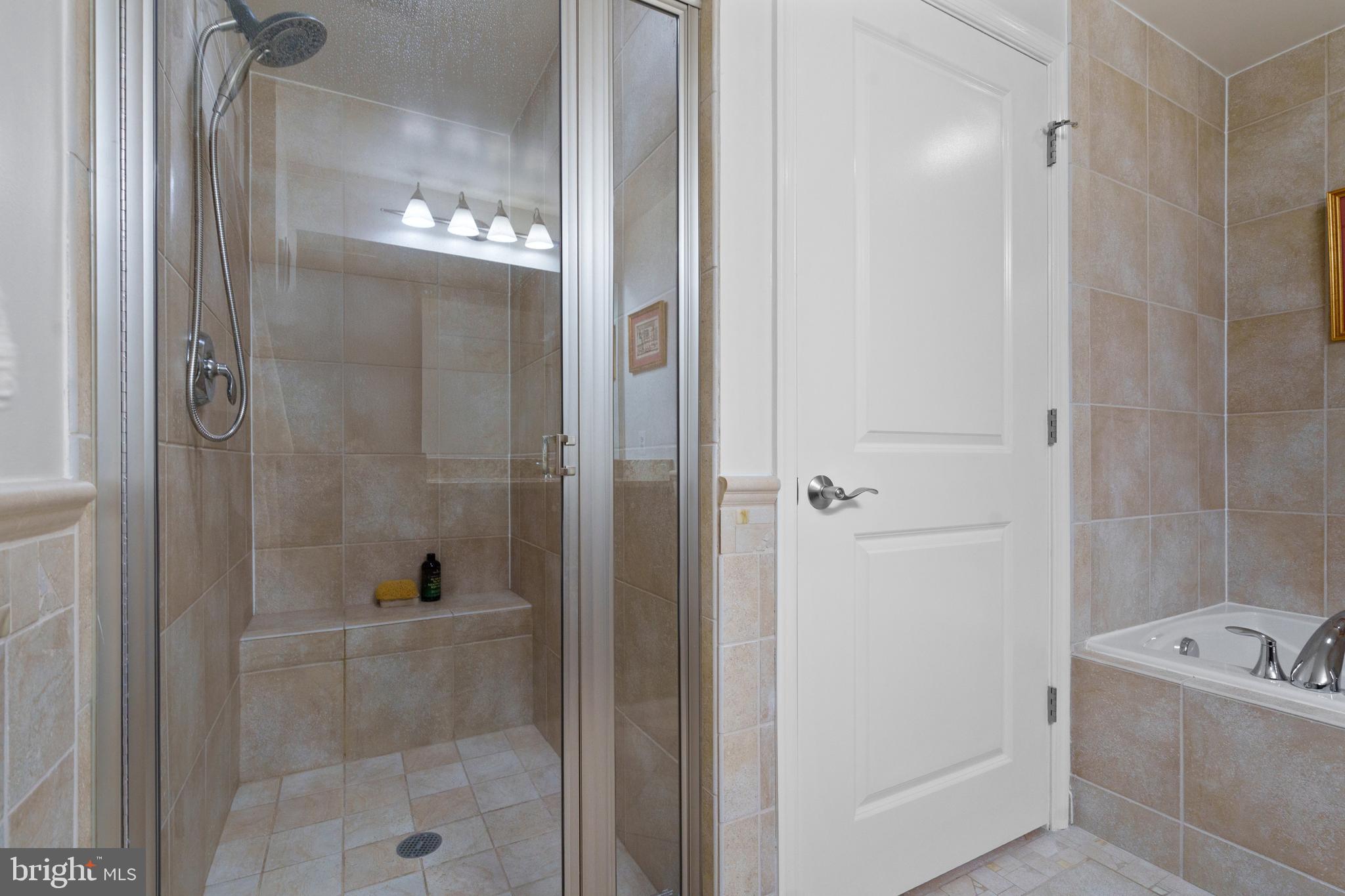 11990 Market Street, Unit 813 Reston, VA 20190 - Photo 23 of 48 a bathroom with a bathtub