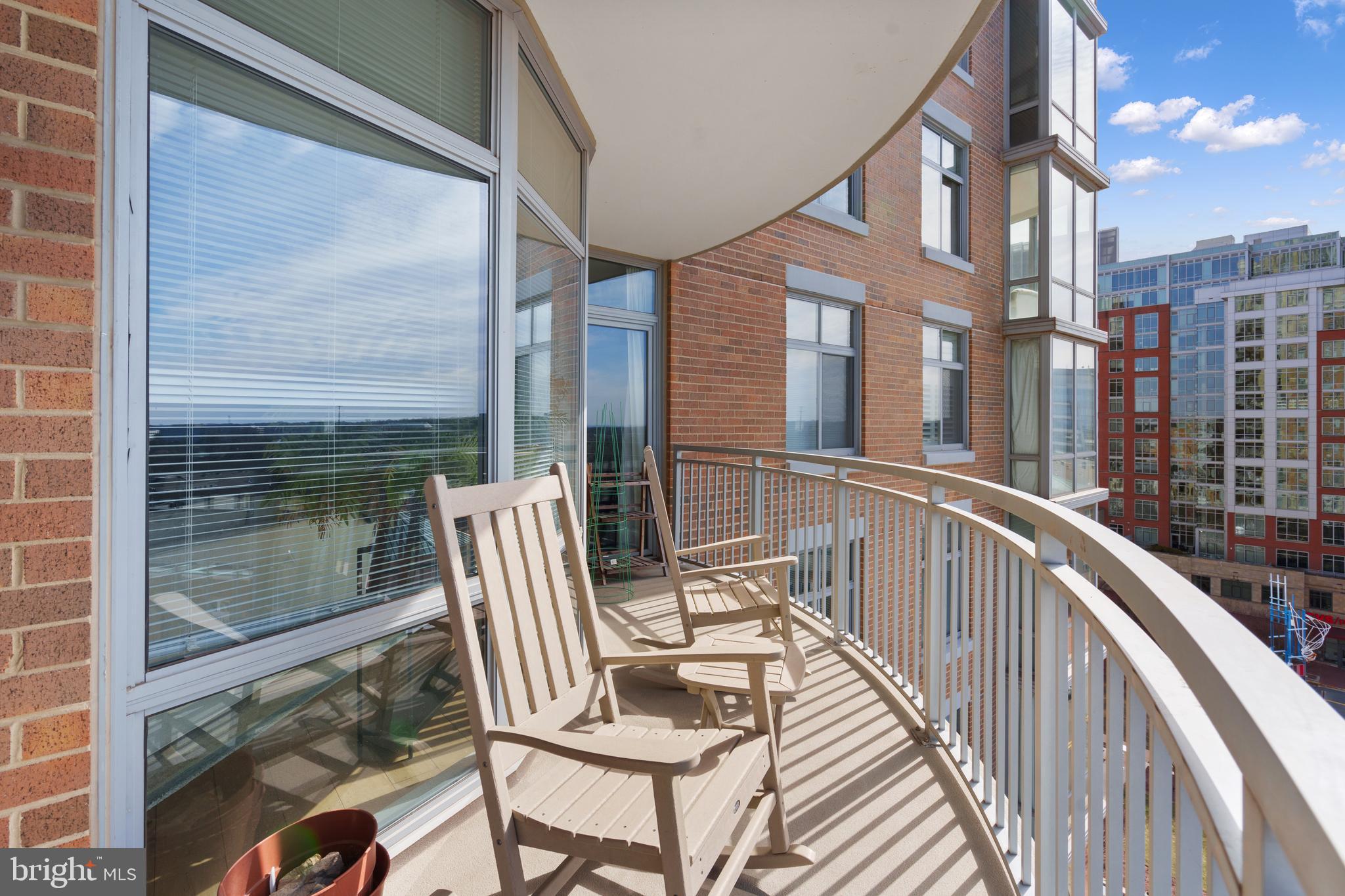 11990 Market Street, Unit 813 Reston, VA 20190 - Photo 26 of 48 a view of balcony with two chairs and a table