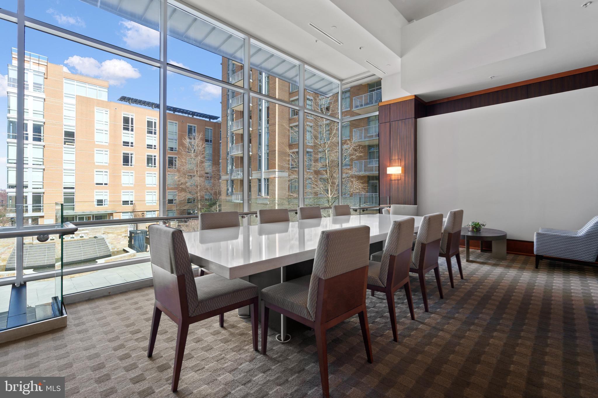 11990 Market Street, Unit 813 Reston, VA 20190 - Photo 29 of 48 a dining room with furniture and wooden floor
