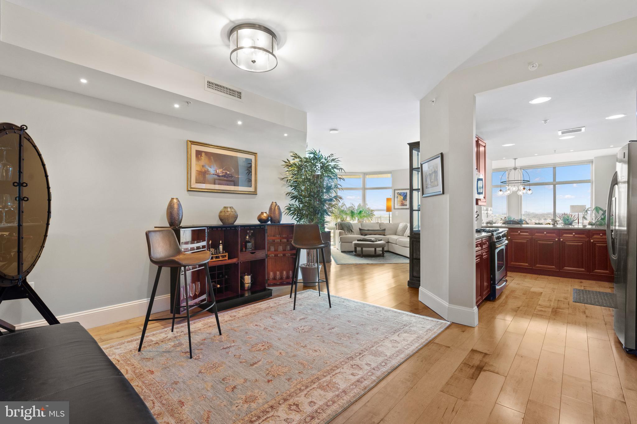 11990 Market Street, Unit 813 Reston, VA 20190 - Photo 3 of 48 a living room with furniture and a wooden floor