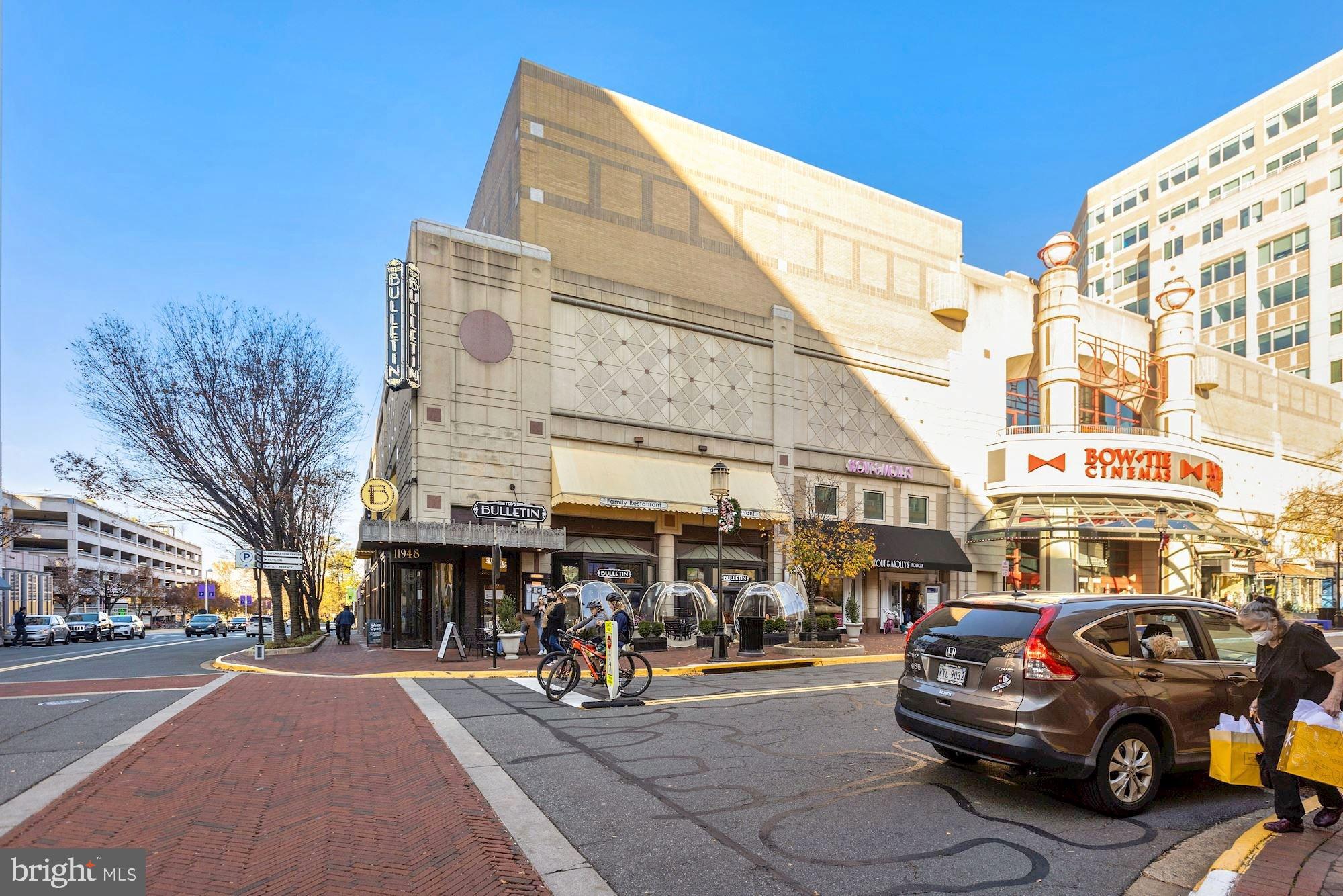 11990 Market Street, Unit 813 Reston, VA 20190 - Photo 45 of 48 a view of a cars park in front of a building