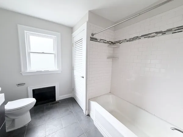 a bathroom with a toilet a sink and a shower