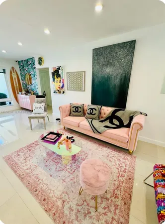 a bedroom with furniture and a wooden floor