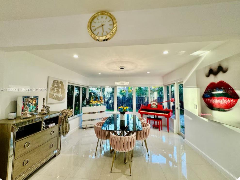 9240 Byron Avenue Surfside, FL 33154 - Photo 12 of 27 a living room with furniture and a large window