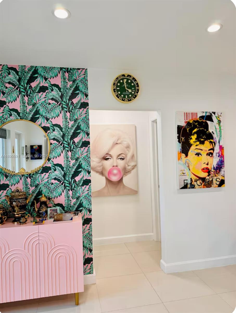 9240 Byron Avenue Surfside, FL 33154 - Photo 13 of 27 a bedroom with a bed and a painting on the wall