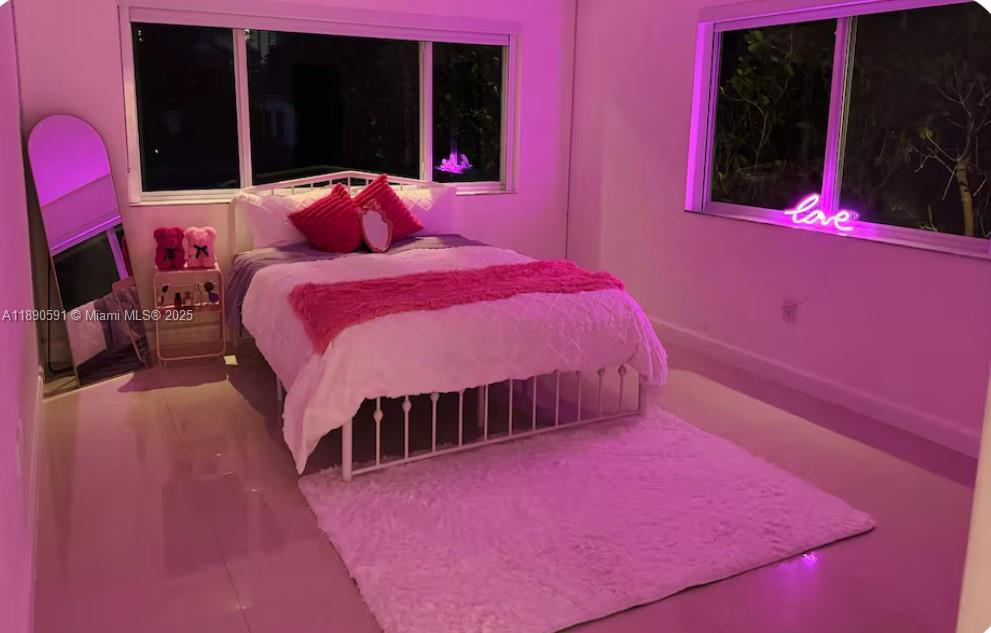 9240 Byron Avenue Surfside, FL 33154 - Photo 20 of 27 a bedroom with a bed and a closet