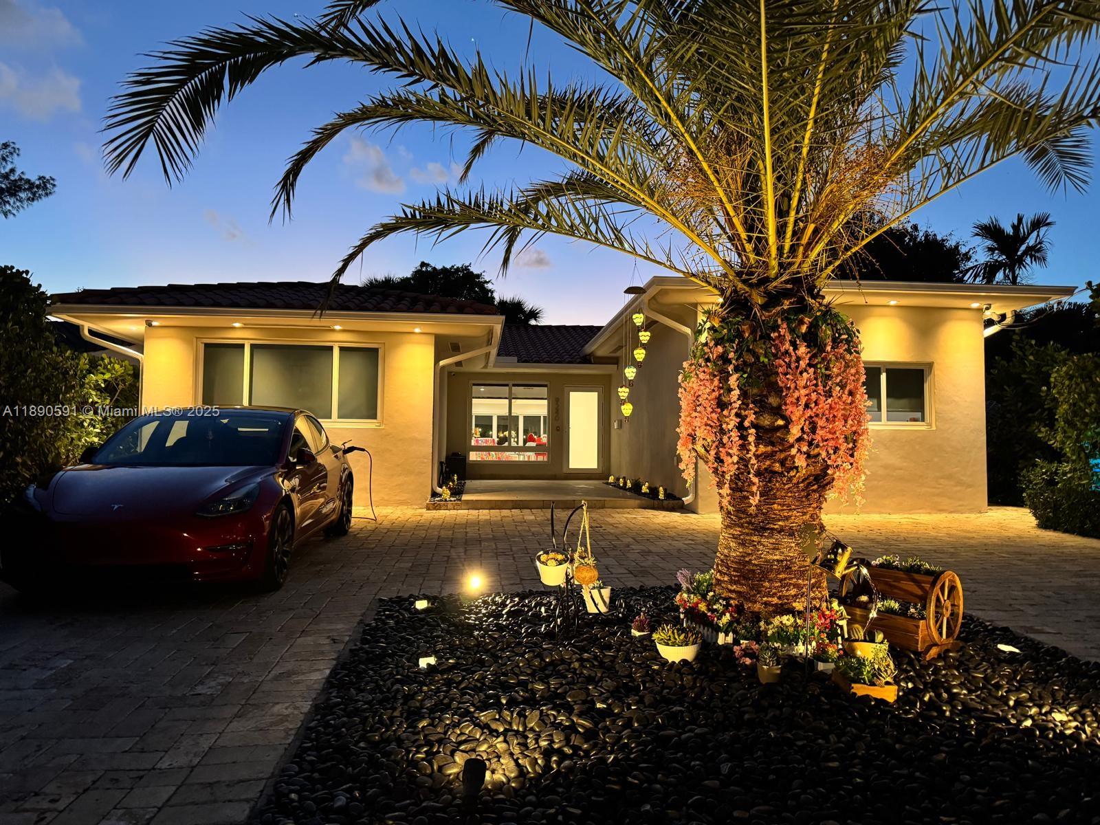 9240 Byron Avenue Surfside, FL 33154 - Photo 26 of 27 a view of a house with a patio