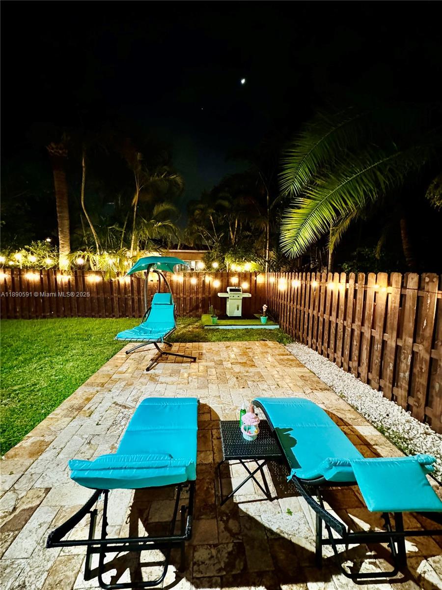 9240 Byron Avenue Surfside, FL 33154 - Photo 27 of 27 a view of yard with seating area