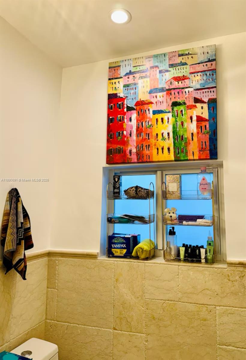 9240 Byron Avenue Surfside, FL 33154 - Photo 8 of 27 a room with toys and storage