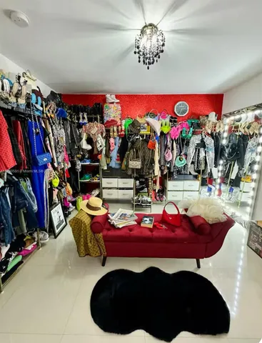 a living room with furniture and flowers