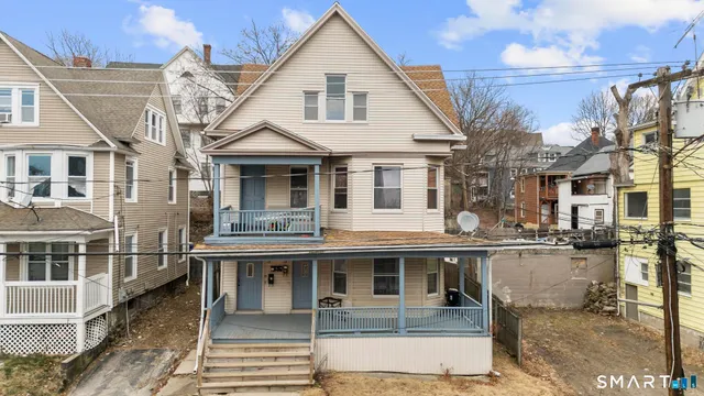 a front view of a house with large windows